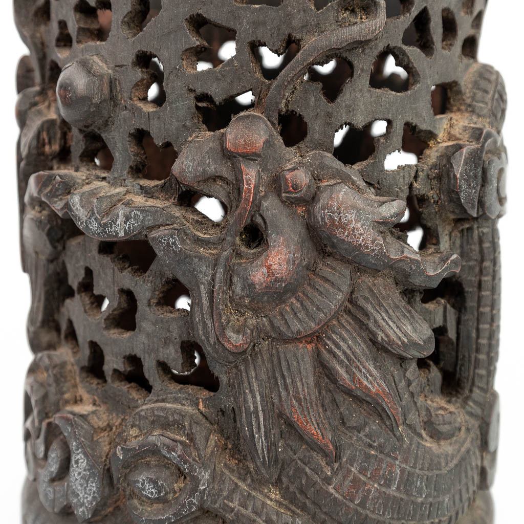 An ajoured vase made of sculptured hardwood with a dragon and foo dog. (H:20,5cm)
