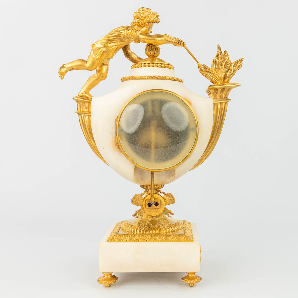 A mantle clock made of white Carrara marble mounted with gilt bronze 