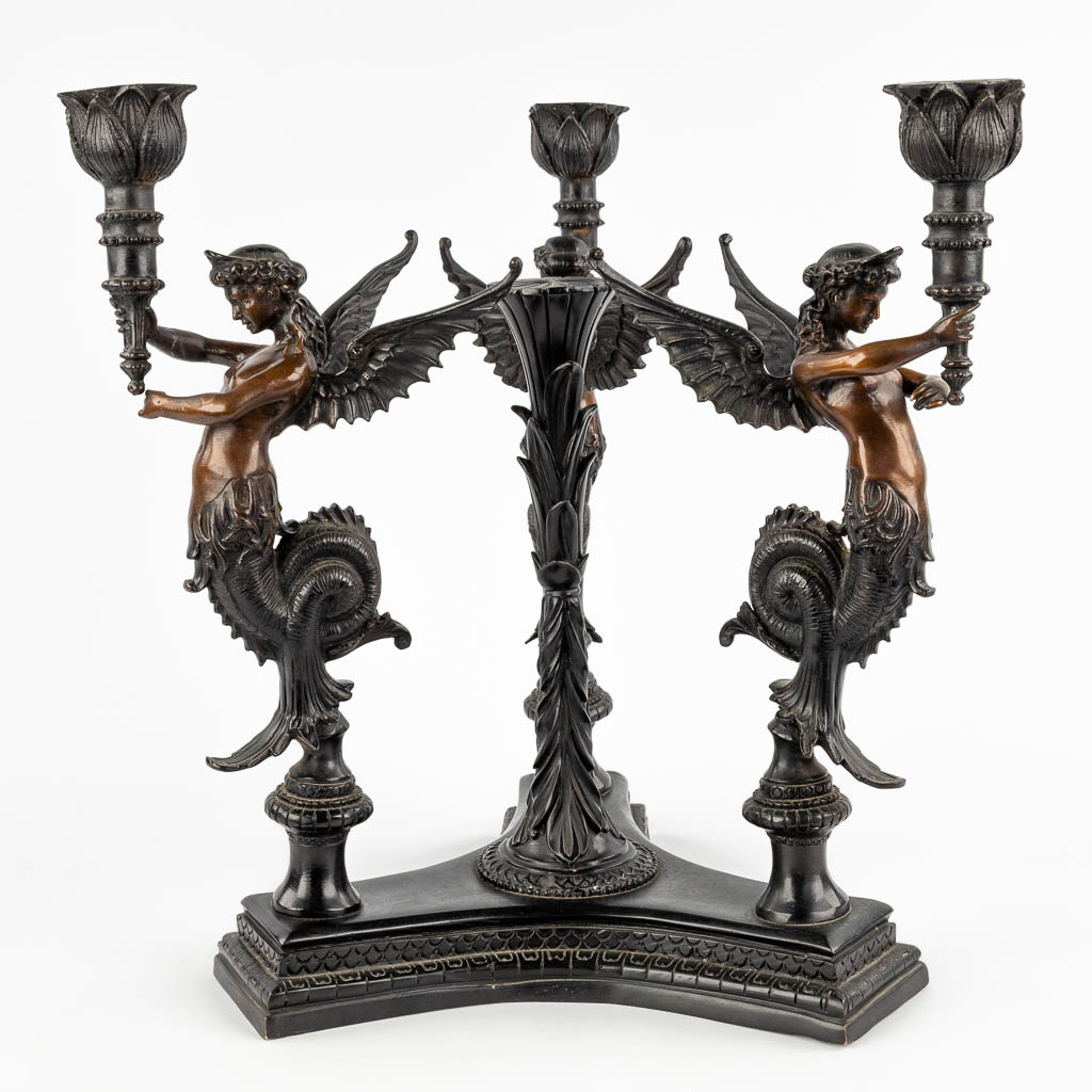 A large table candelabra decorated with three 'Mélusines', patinated bronze. 20th C. (D:35 x W:35 x H:44 cm)
