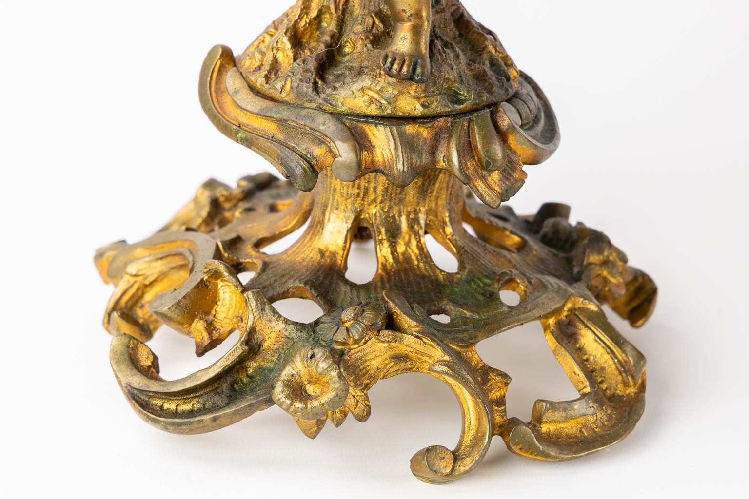 A three-piece mantle garniture clock and candelabra, gilt bronze. 19th C. (L:21 x W:55 x H:48 cm)