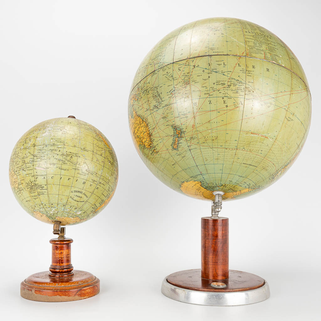 A set of 2 globes marked G. Thomas and Columbus Erdglobus