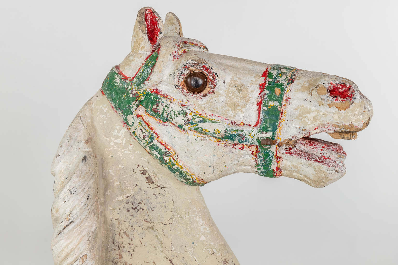 An antique horse for a Merry Go Round, made of sculptured wood, with original polychrome (D:32 x W:130 x H:240 cm)