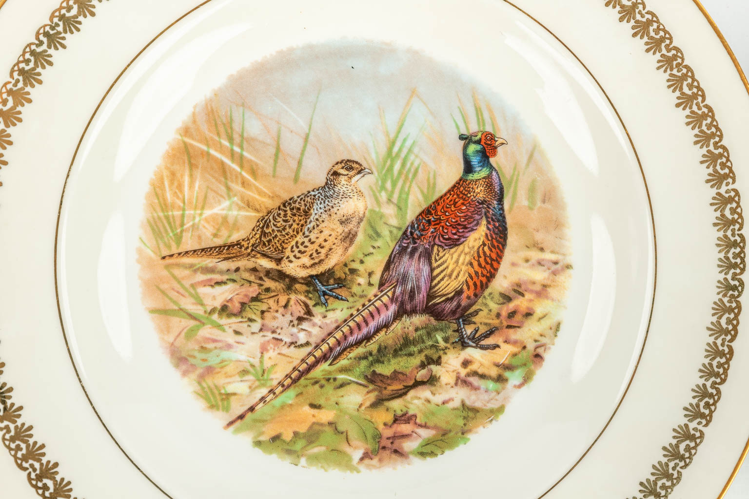A 30-piece dinner service decorated with wildlife, made of porcelain and marked Porcelain de Limoges. (H:16,5cm)