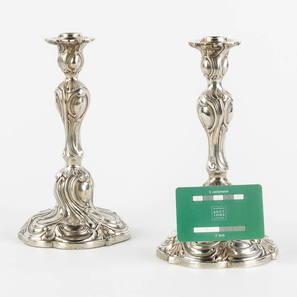 Th. Strube & Sohn, a pair of candlesticks, silver in Louis XV style. Germany. 800/1000. (H:22 x D:12,5 cm)