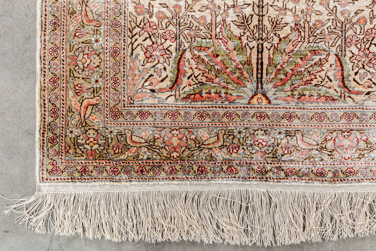 An Oriental hand-made carpet with 