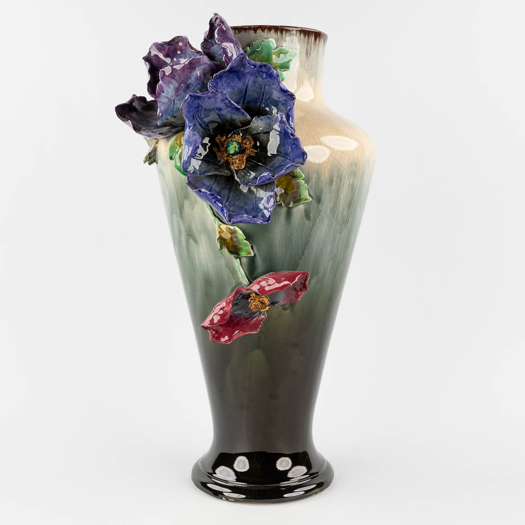 A large vase made of Hasselt Earthenware, decorated with Flowers. Made in Hasselt, Belgium. Circa 1900. (L: 29 x W: 35 x H: 61 c