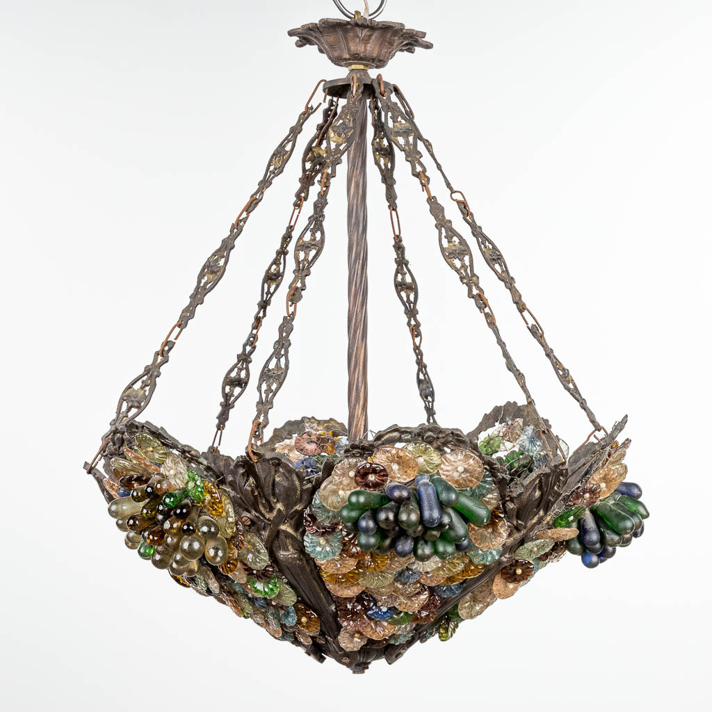 A decorative chandelier decorated with coloured glass and made in Italy. (H:65cm)