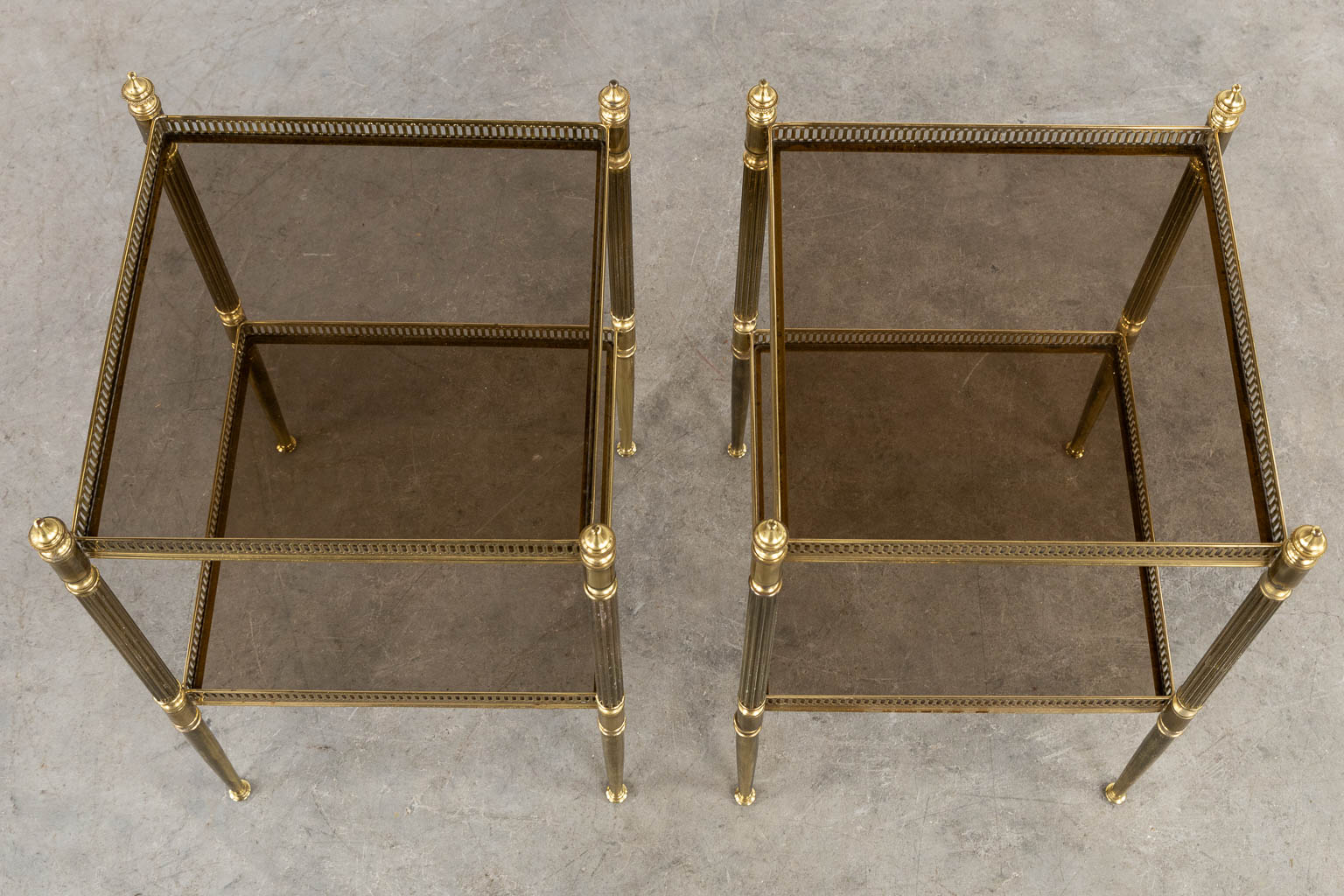A pair of two-tier side tables in the style of Maison Jansen. (L:34 x W:34 x H:59 cm)