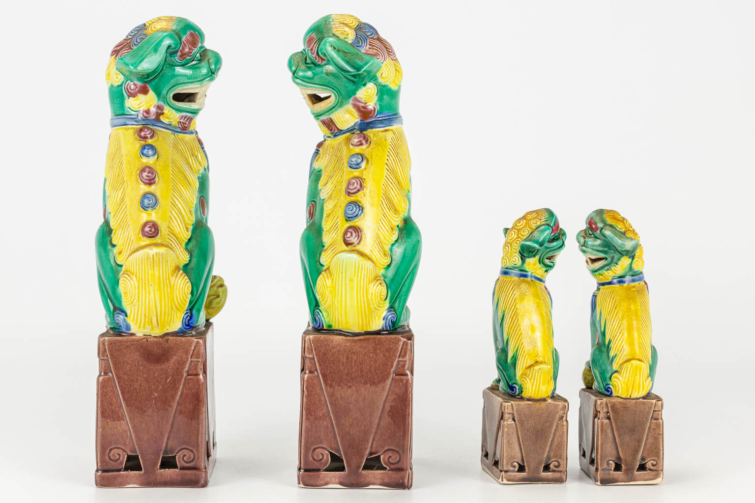 A collection of 2 pairs of Foo Dogs. 