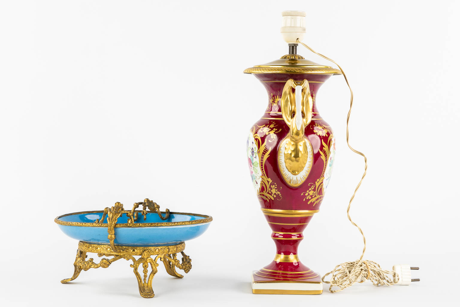 Limoges and Sèvres marks, a lamp base and a tazza with a hand-painted flower decor. (H:40 cm)
