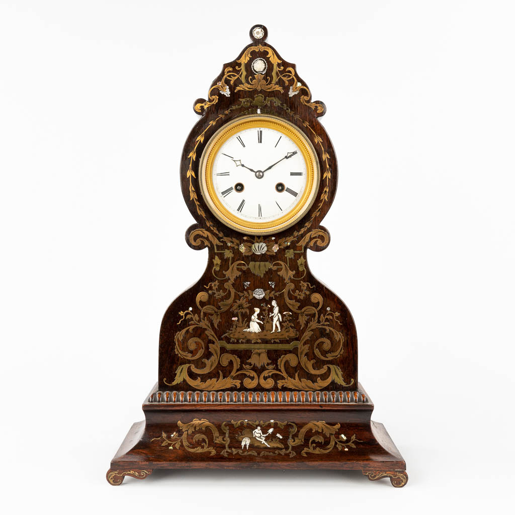 A neoclassical table clock. France, 19th century. (L: 15 x W: 30 x H: 46 cm)