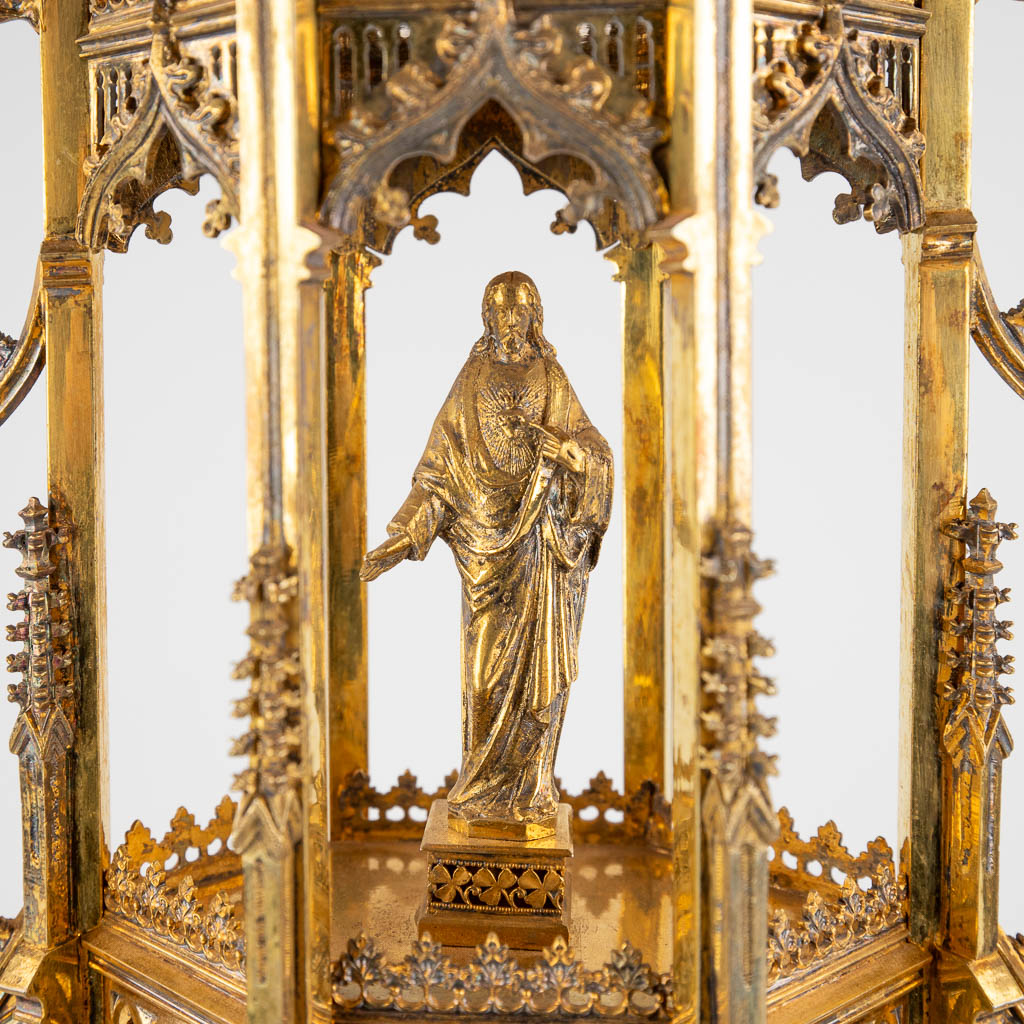 A large tower monstrance, gilt silver and brass in a Gothic Revival style. 19th C. (D:14 x W:26 x H:66 cm)