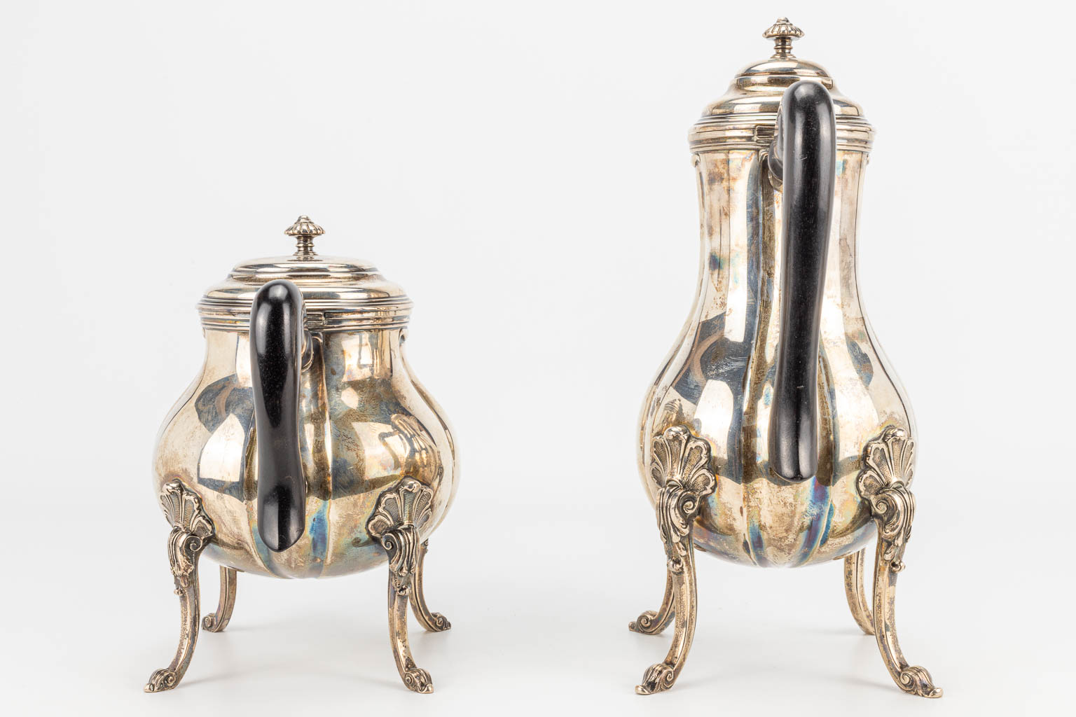 A coffee and tea service made of silver and marked 800 and Delheid Frères. 