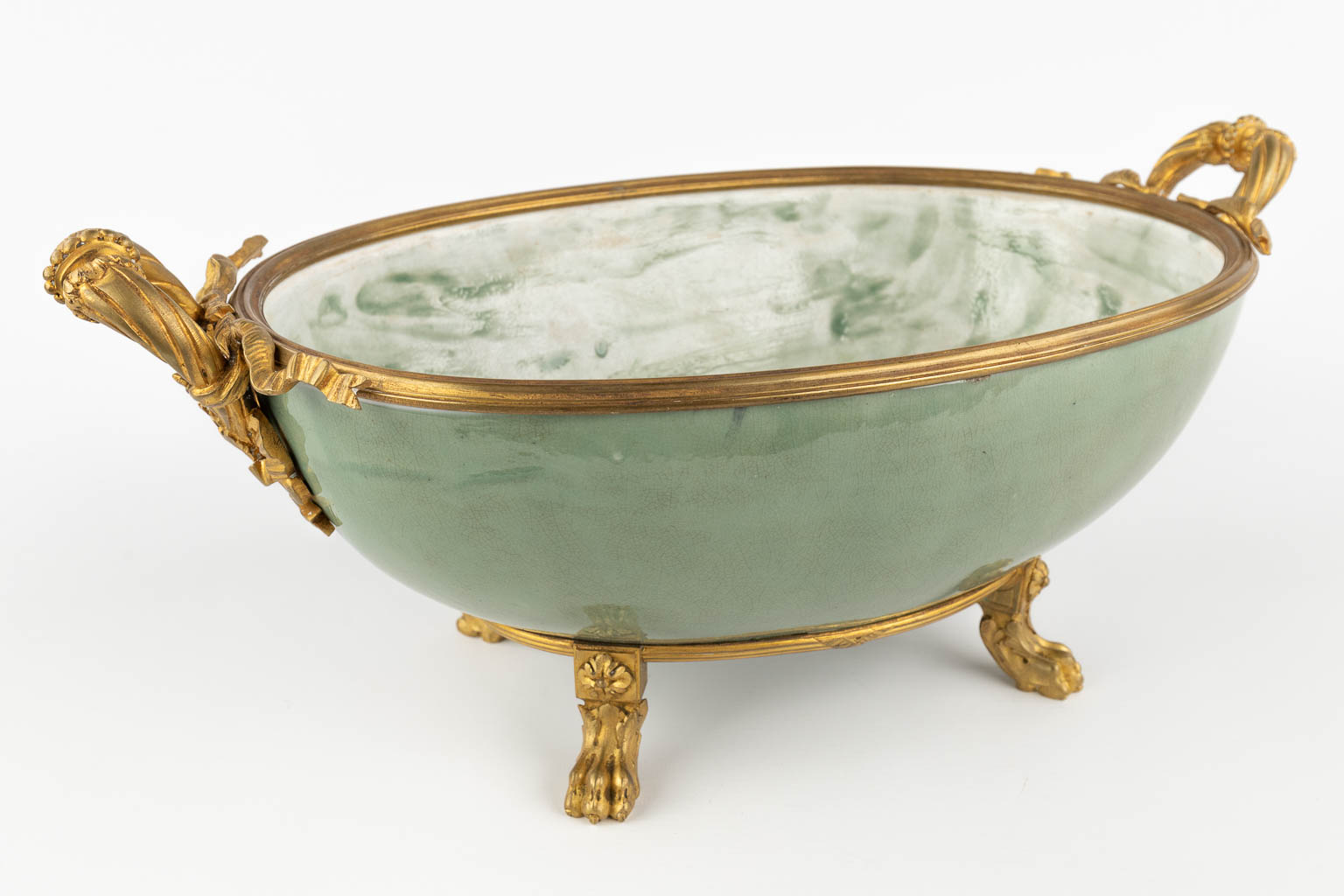 A large bowl mounted with gilt bronze. Glazed stoneware. (D:26 x W:47 x H:20 cm)