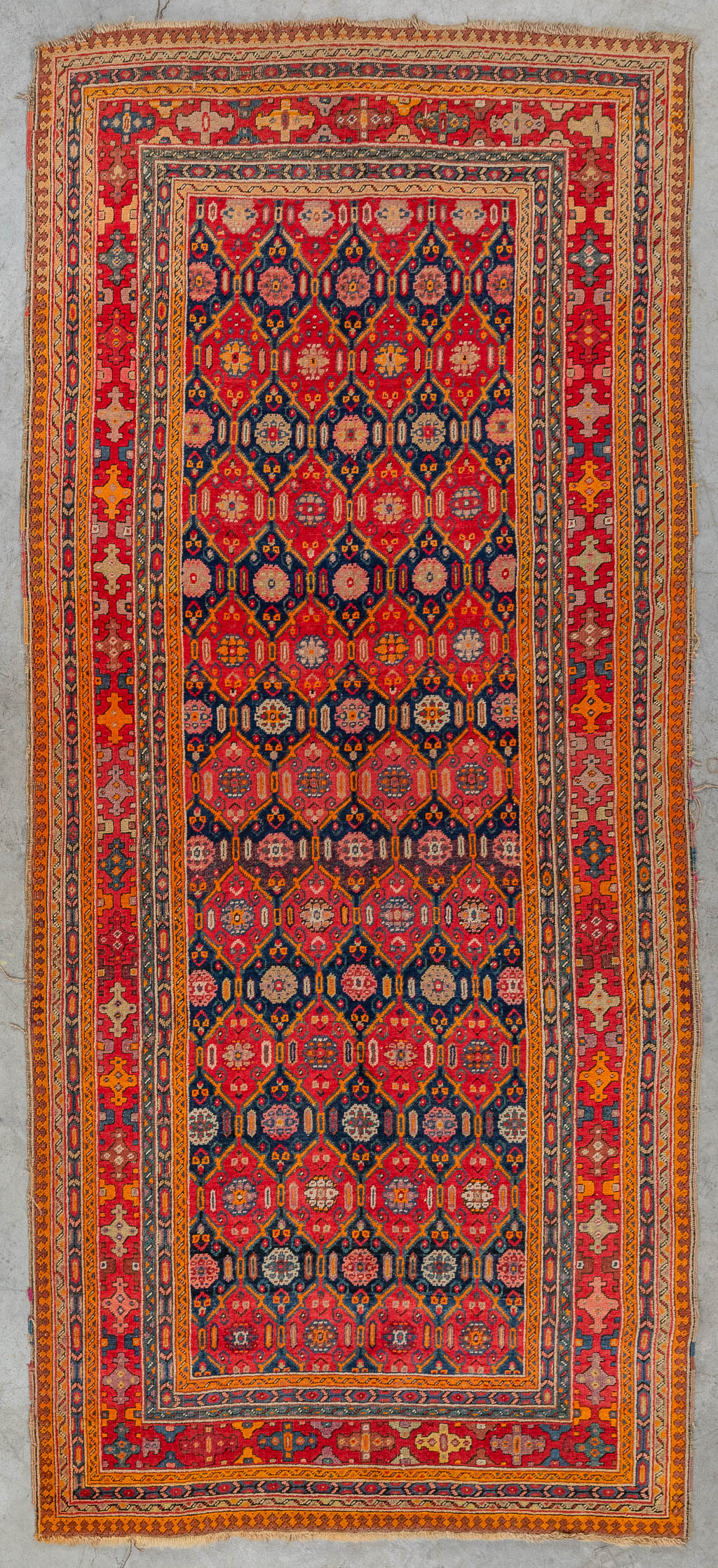 An Oriental hand-made carpet, Karabach (D:290 x W:128 cm)
