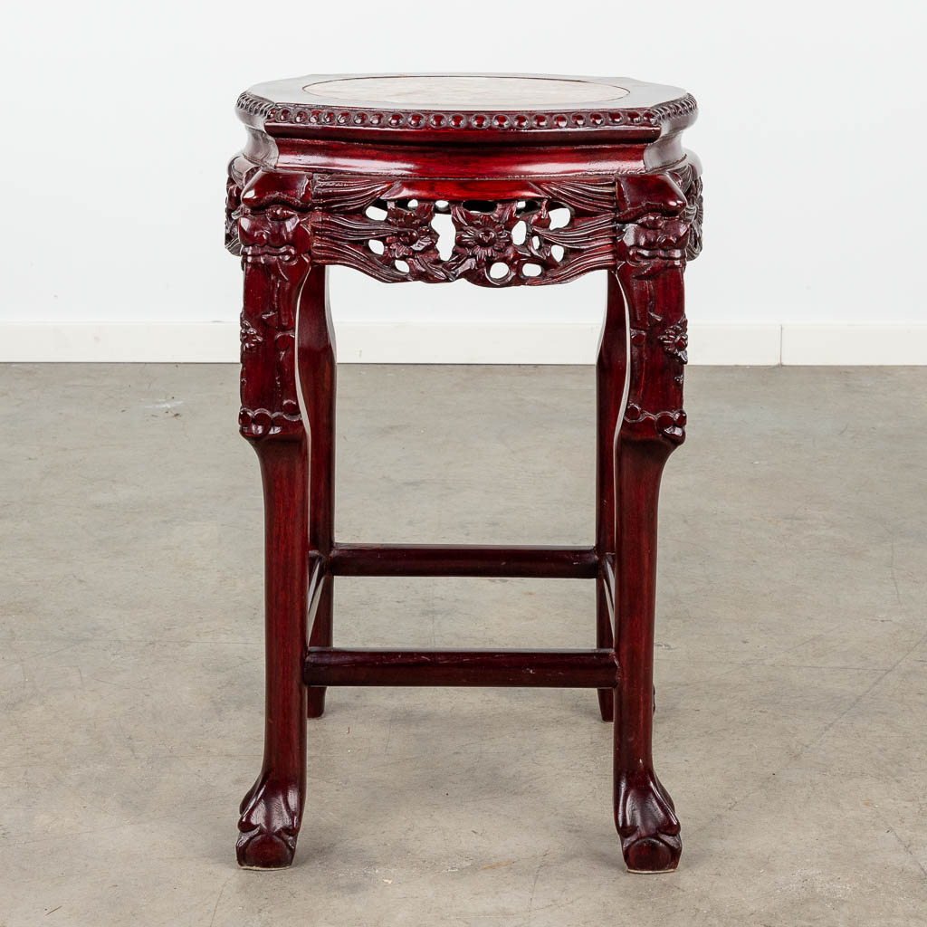 An Oriental stand, hardwood and decorated with a marble top. (L: 40 x W: 40 x H: 62 cm)