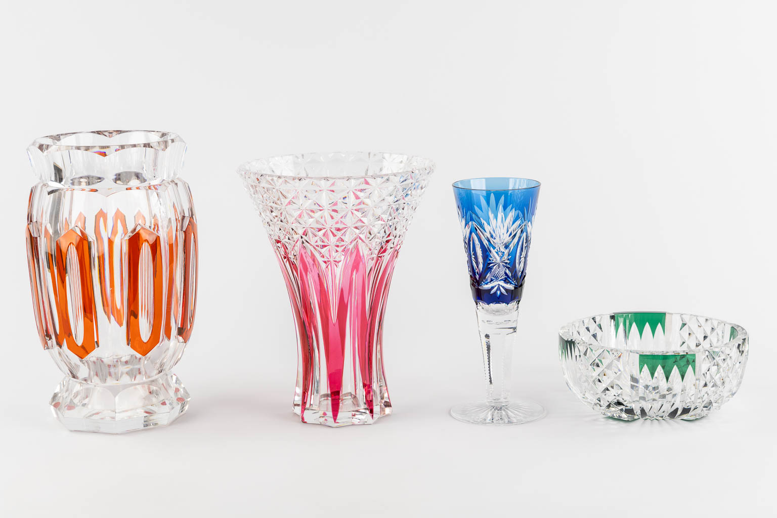 Val Saint Lambert, four pieces of cut and coloured crystal. (H:31 x D:19 cm)