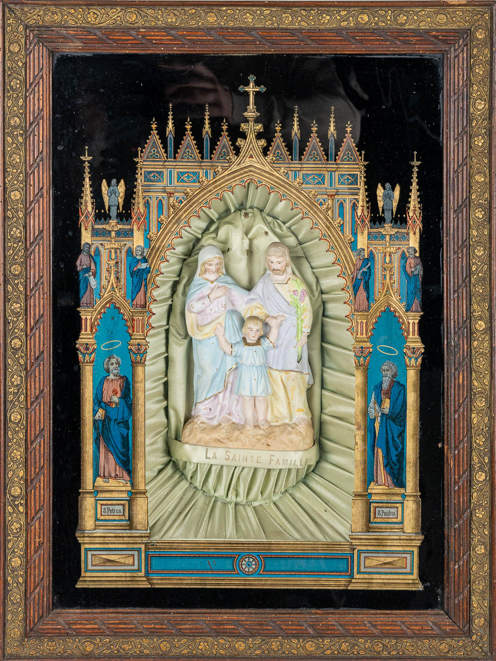 An Eglomisé reverse glass painting in gothic revival style, with a holy family statue made of bisque porcelain. (H:63cm)