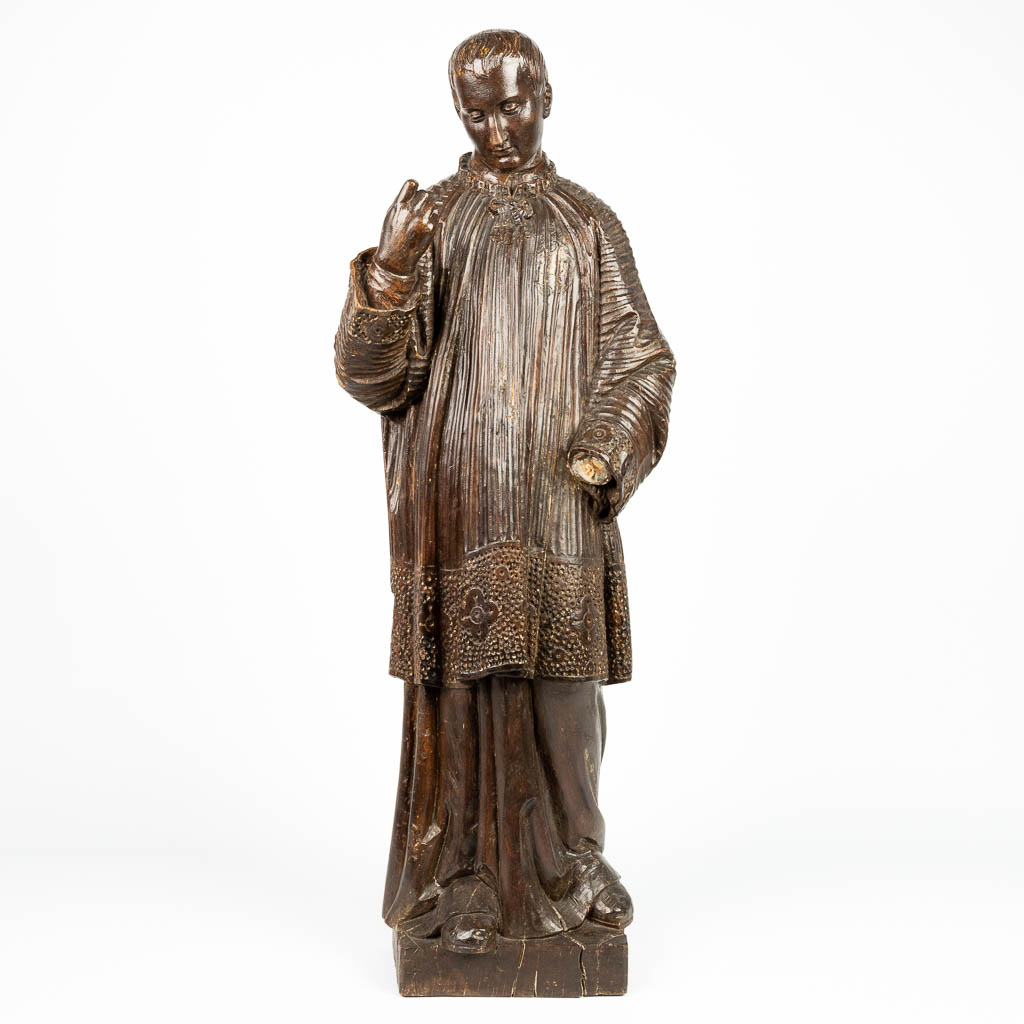 A wood sculpture of a priest, 19th century. (H:103cm)