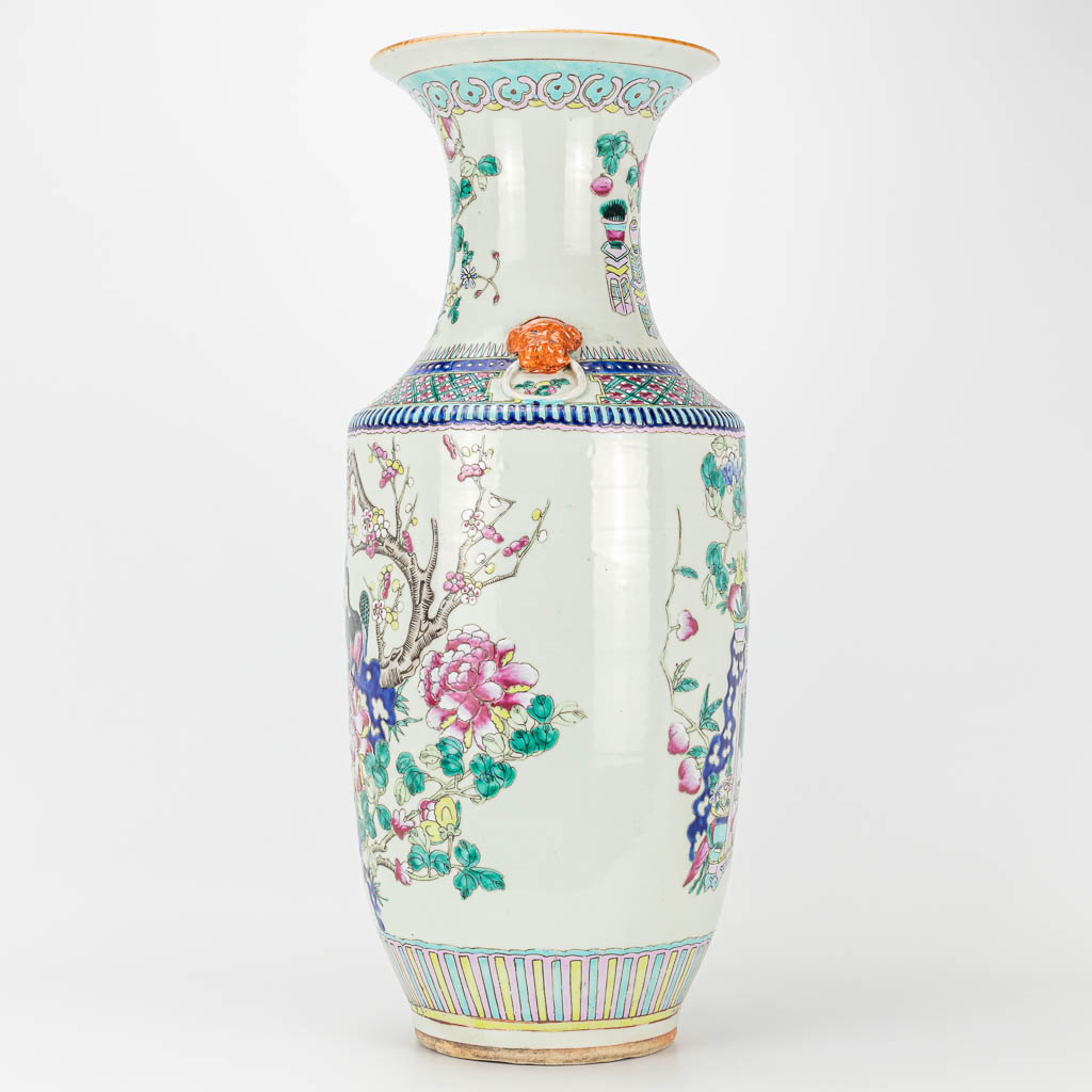A vase made of Chinese porcelain, decorated with antiquities and peacocks. 19th century. 