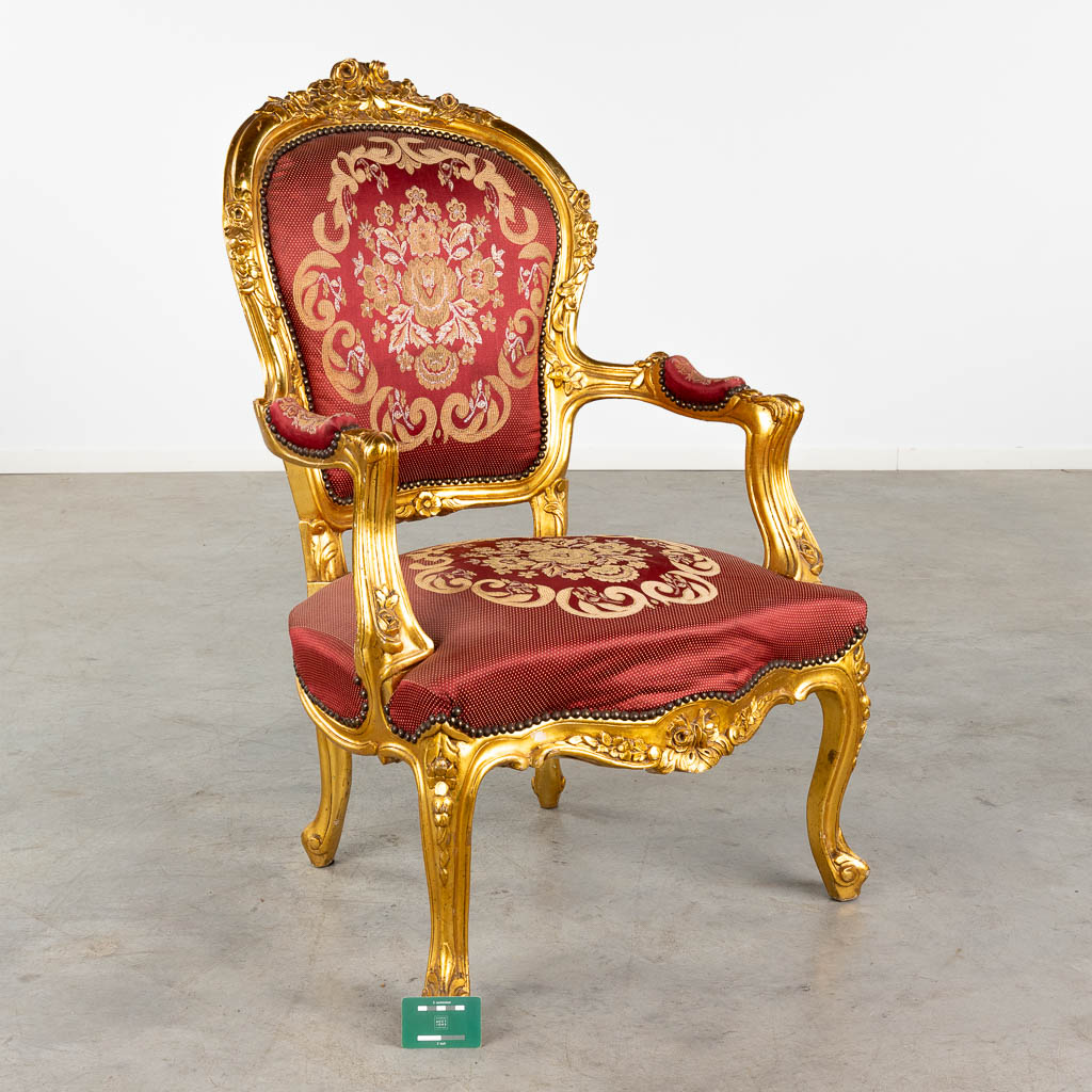 An armchair, gilt wood in Louis XV style. 20th C. (D:78 x W:67 x H:107 cm)