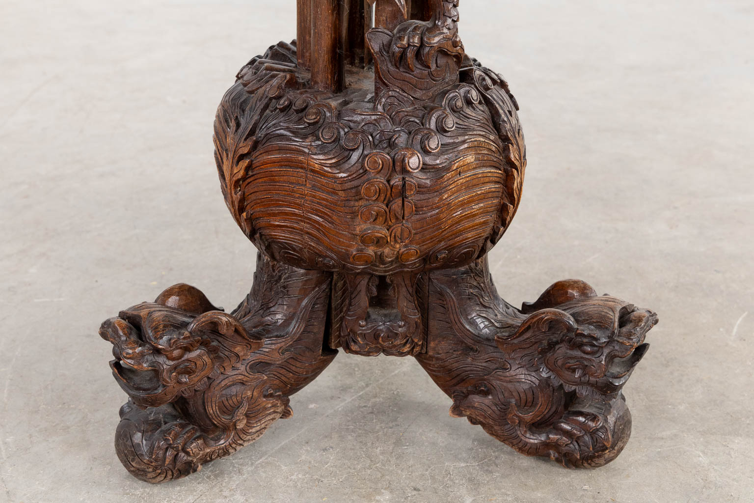 A Oriental hardwood pedestal with a sculptured dragon. (W:42 x H:125 cm)