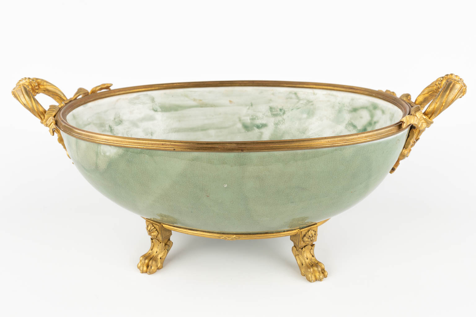 A large bowl mounted with gilt bronze. Glazed stoneware. (D:26 x W:47 x H:20 cm)