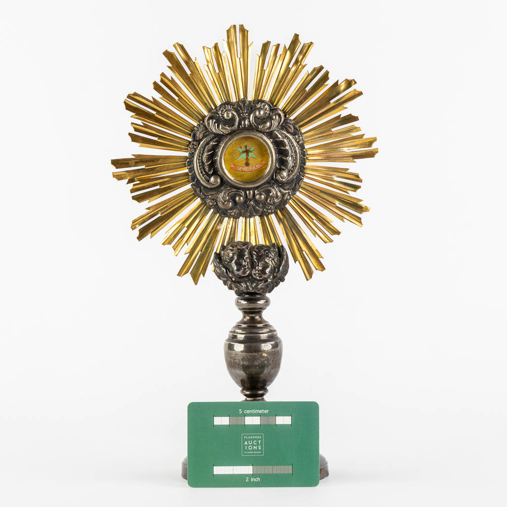 A small sunburst monstrance with a relic for the 