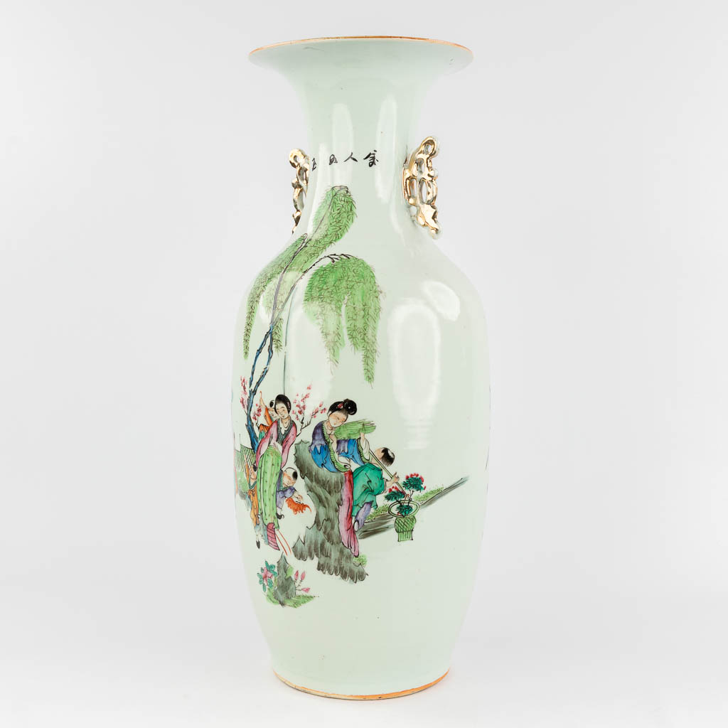 A Chinese vase, porcelain decorated with ladies and playing children. 19th/20th C. (H: 57 x D: 24 cm)