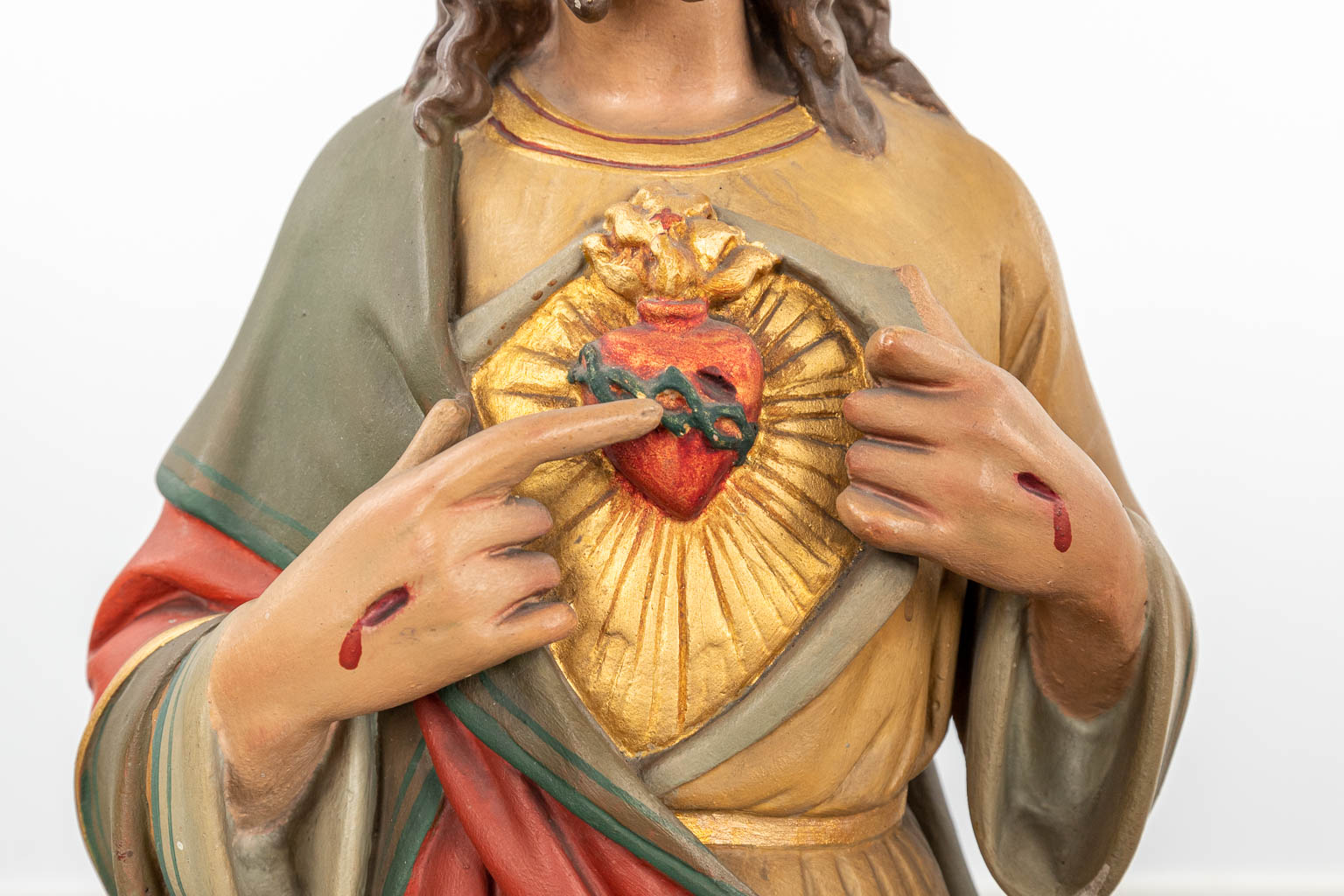 A collection of 3 large polychrome plaster statues of Jesus 