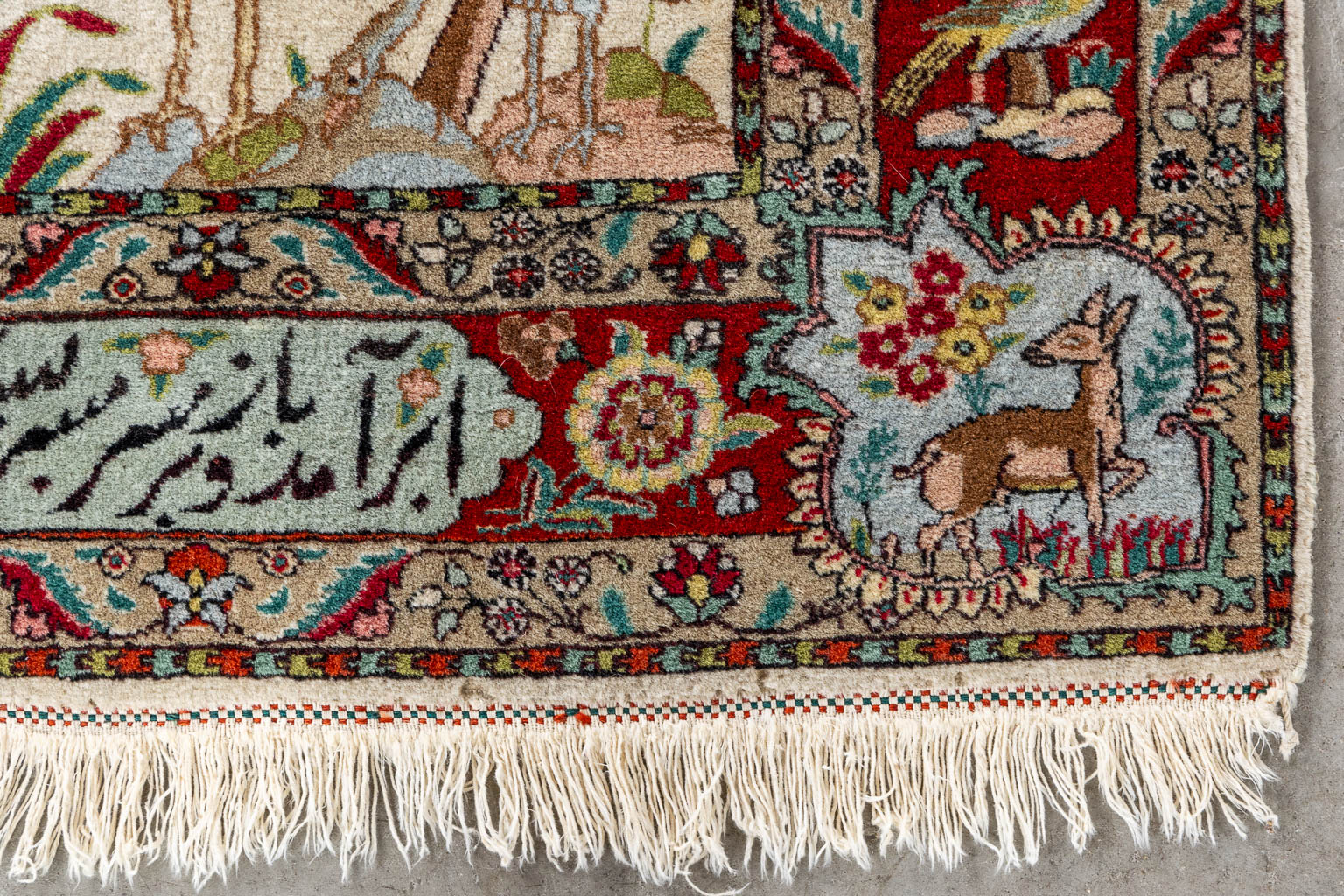 An Oriental hand-made carpet, Tabriz. Signed. (L:150 x W:107 cm)