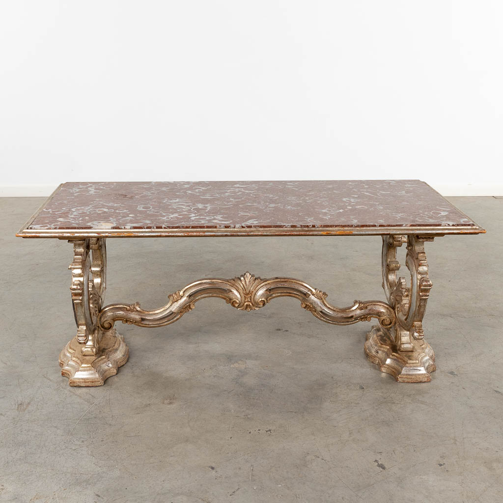 An Italian coffee table with a red marble top. 20th C. (D:62 x W:123 x H:51 cm)