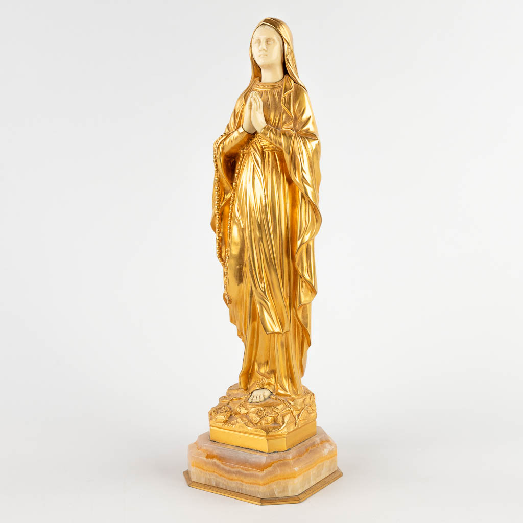 Dominique ALONZO (act.1910-1930) 'Mary' an ormolu gilt bronze figurine, 19th C. (D:10 x W:10 x H:32 cm)
