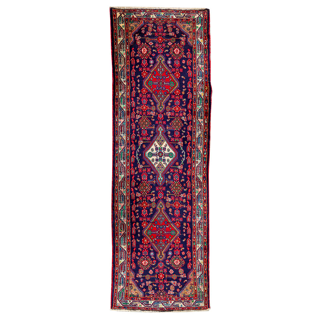 An oriental hand-made carpet runner. Kerman. (308 x 103 cm)