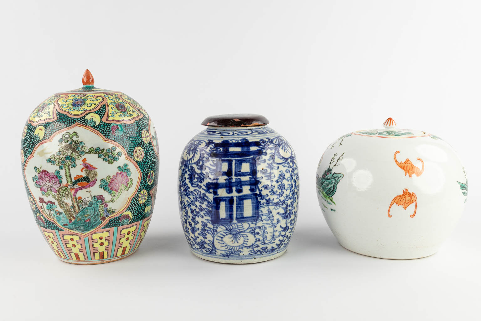 Three Chinese ginger jars with polychrome and blue-white decors. 19th/20th C. (H:32 x D:22 cm)