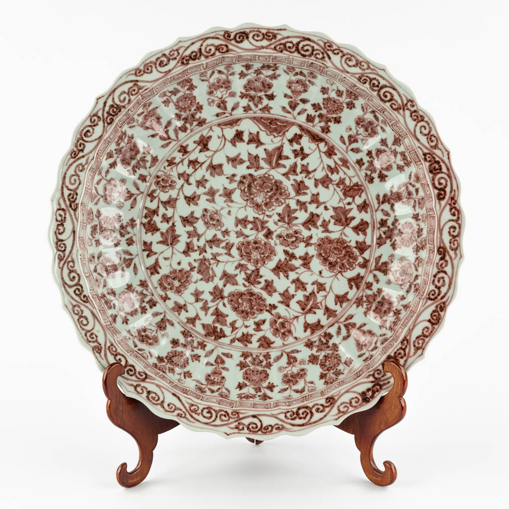 A large Chinese plate with red glaze, peonies. 19th/20th C. (D:46 cm)