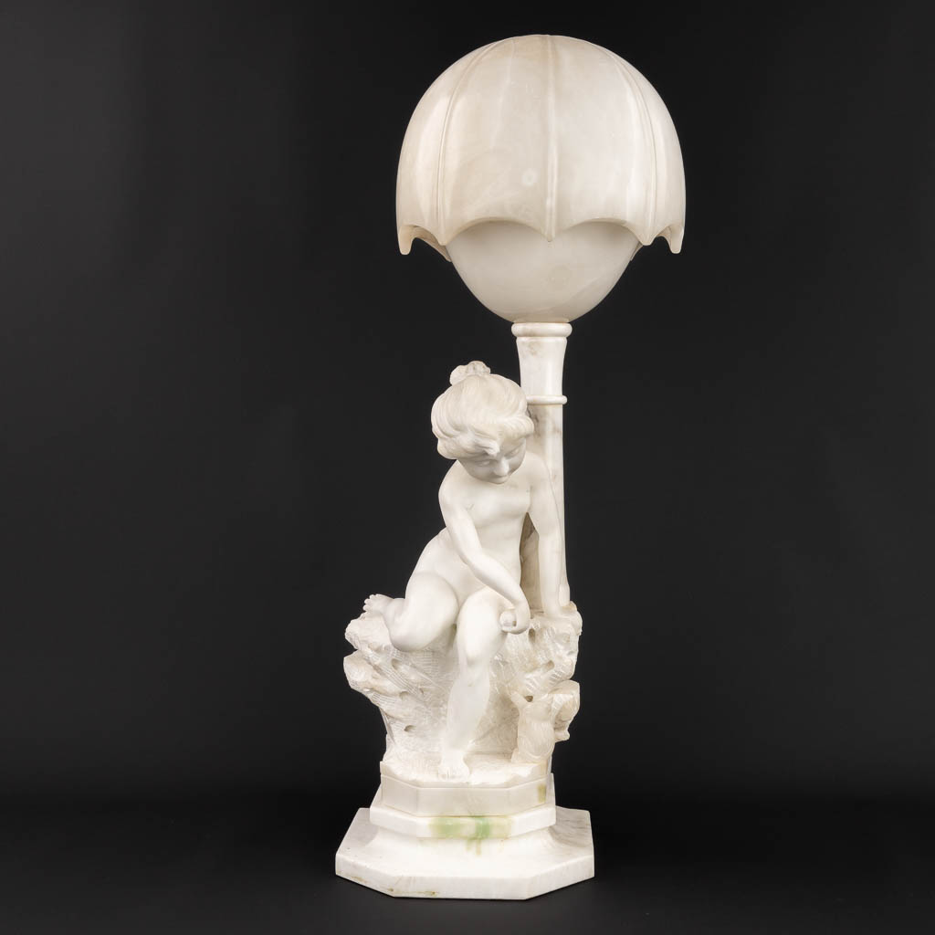  A vintage table lamp, made of sculptured alabaster. Made in Italy, 20th century. (H:71 cm)