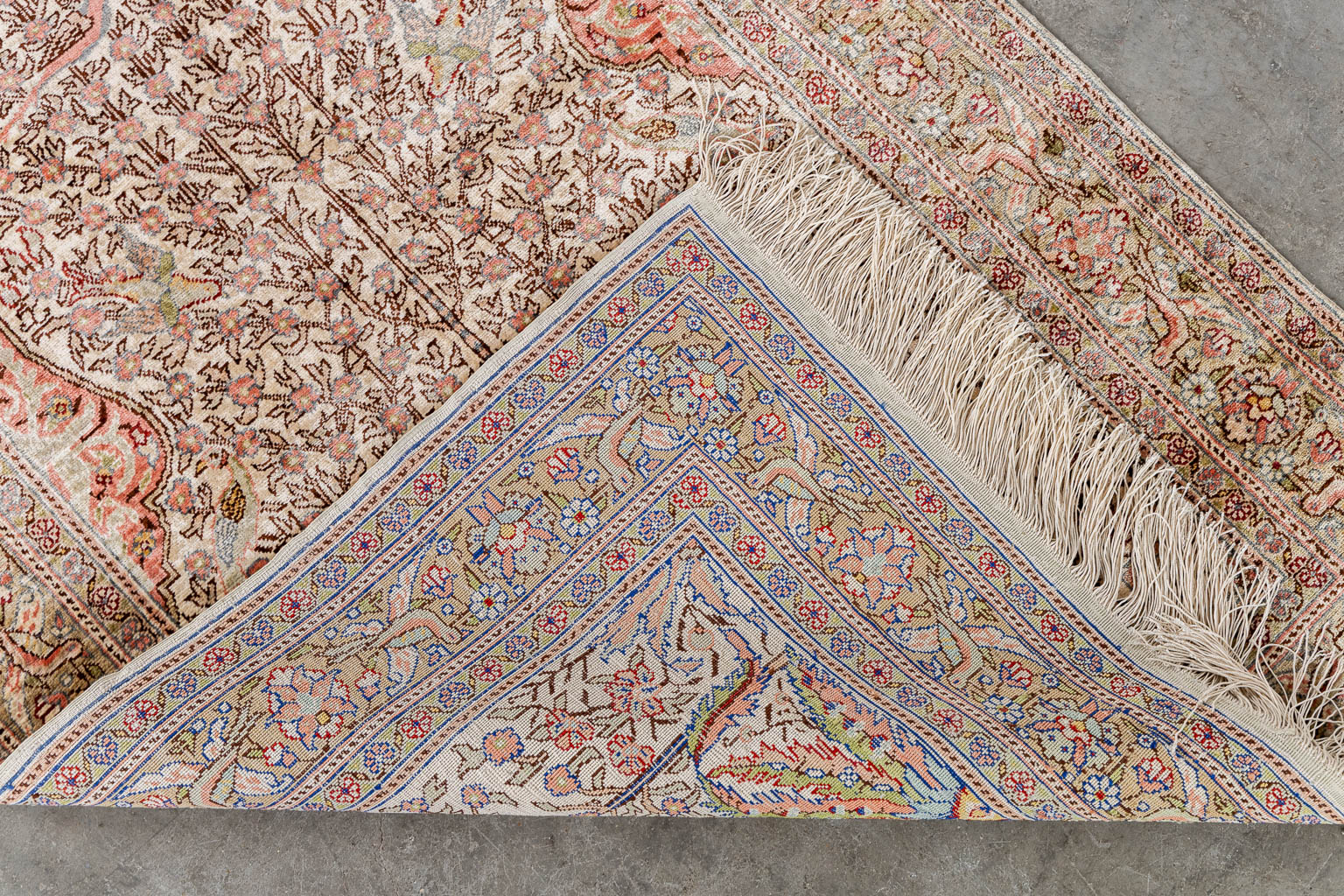 An Oriental hand-made carpet with 