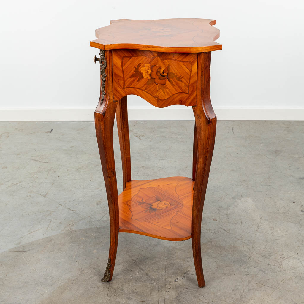 A side table finished with marquetry inlay and mounted with bronze. (H:69cm)