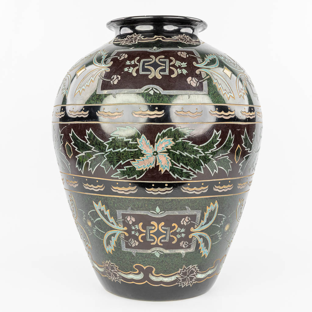 A decorative vase made of glazed porcelain with relief decor. (H:52cm)