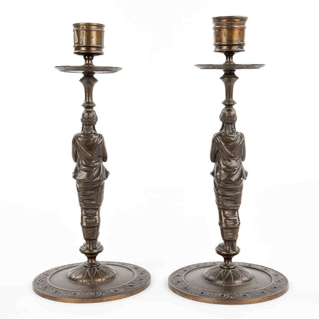 A pair of caryatid candlesticks, Empire style, patinated bronze, 19th century. (H:23cm)