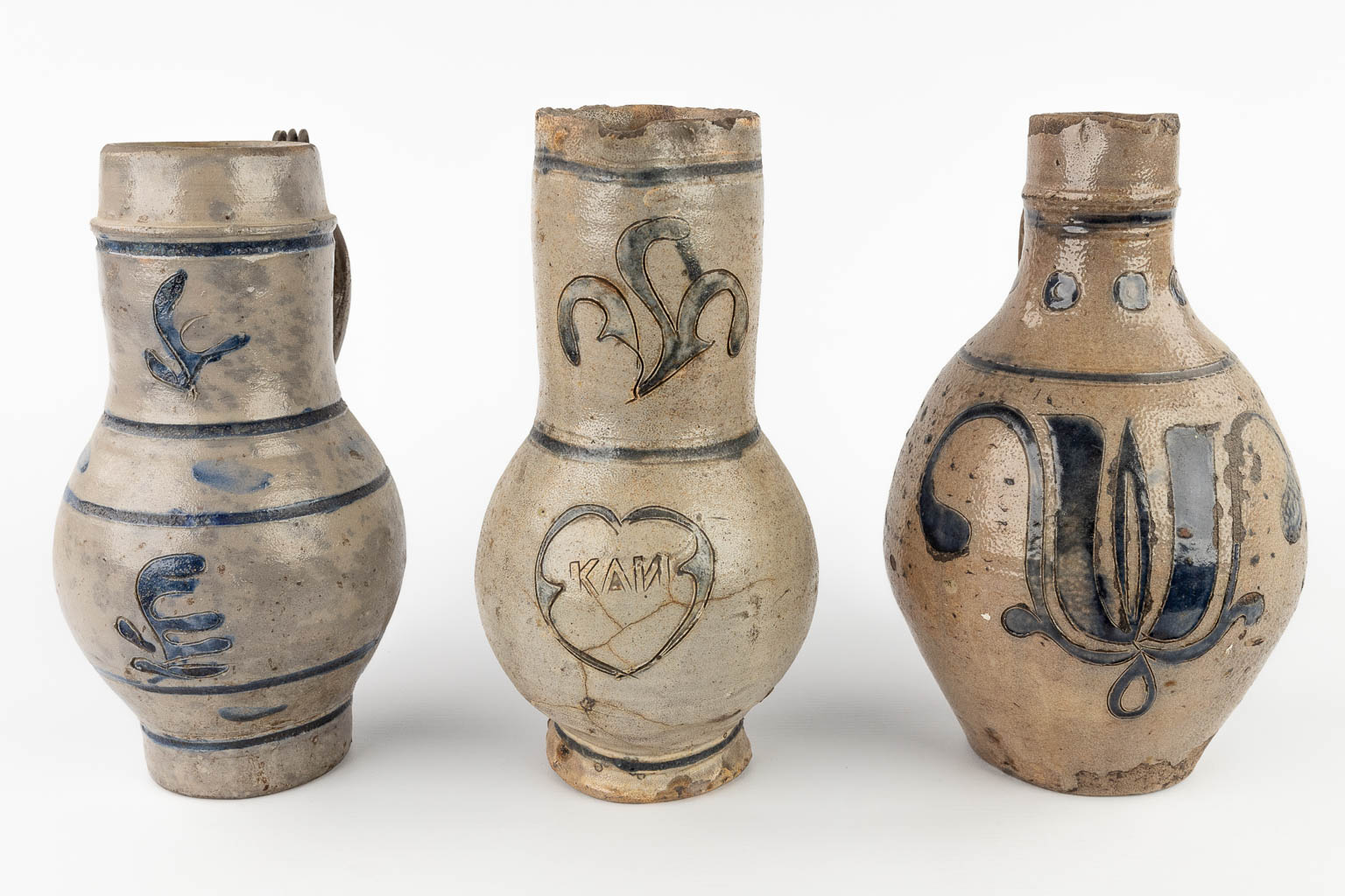 Three antique pitchers, grès, probably Germany, 18th C. (H:28 x D:14 cm)