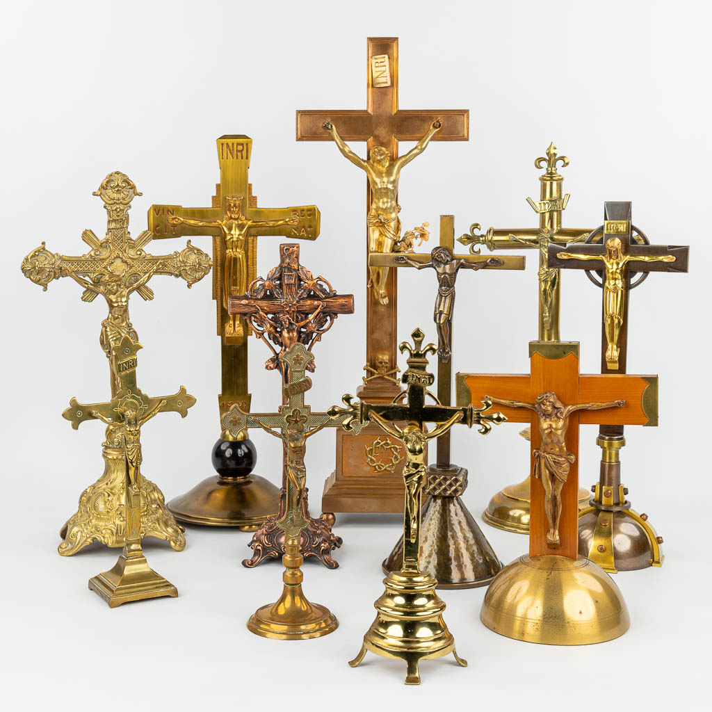 A large collection of crucifixes made of bronze, brass and metal. (H:65cm)