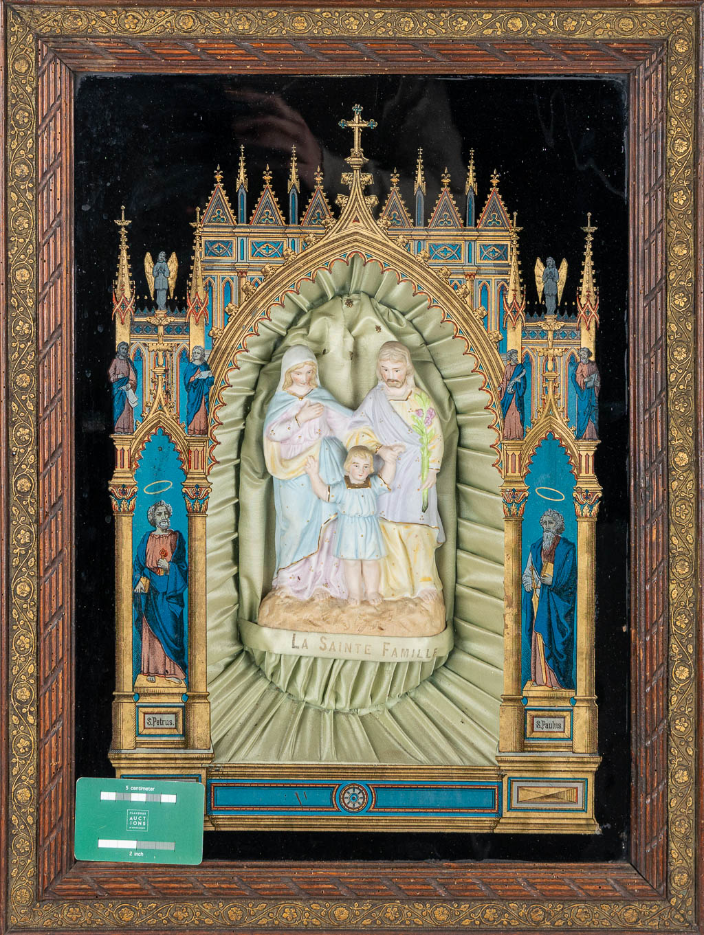 An Eglomisé reverse glass painting in gothic revival style, with a holy family statue made of bisque porcelain. (H:63cm)