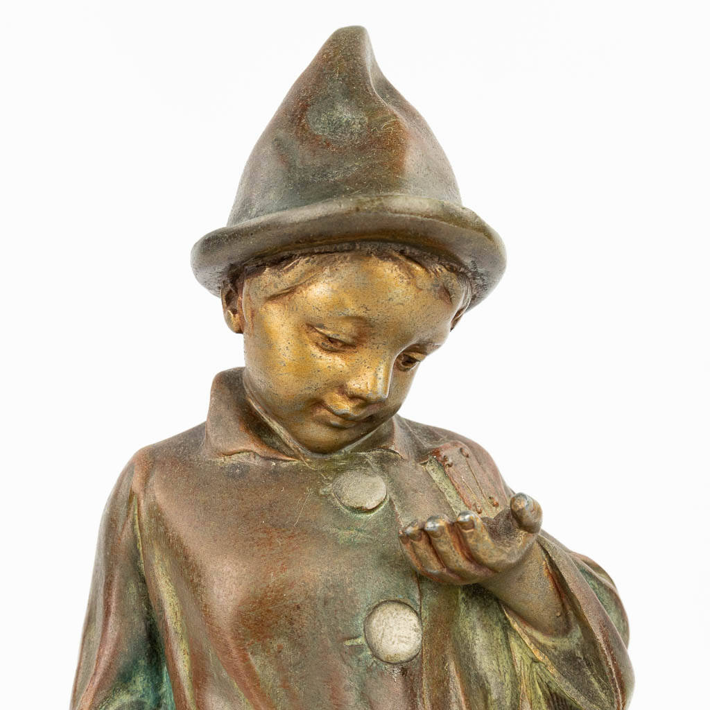 A collection of 3 statues of boys made of bronze and spelter. (H:30,5cm)