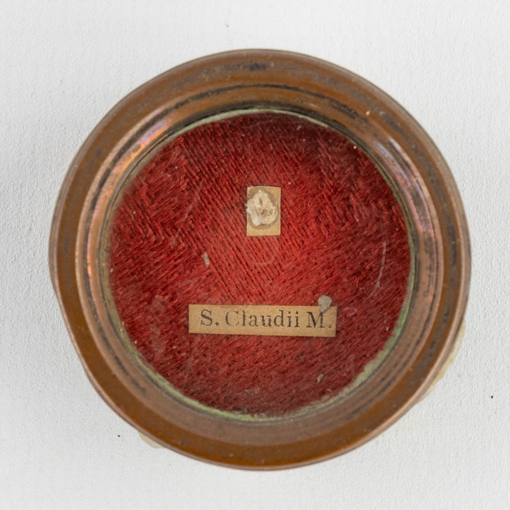 A sealed theca with a relic: Ex Ossibus Sancti Claudii M.