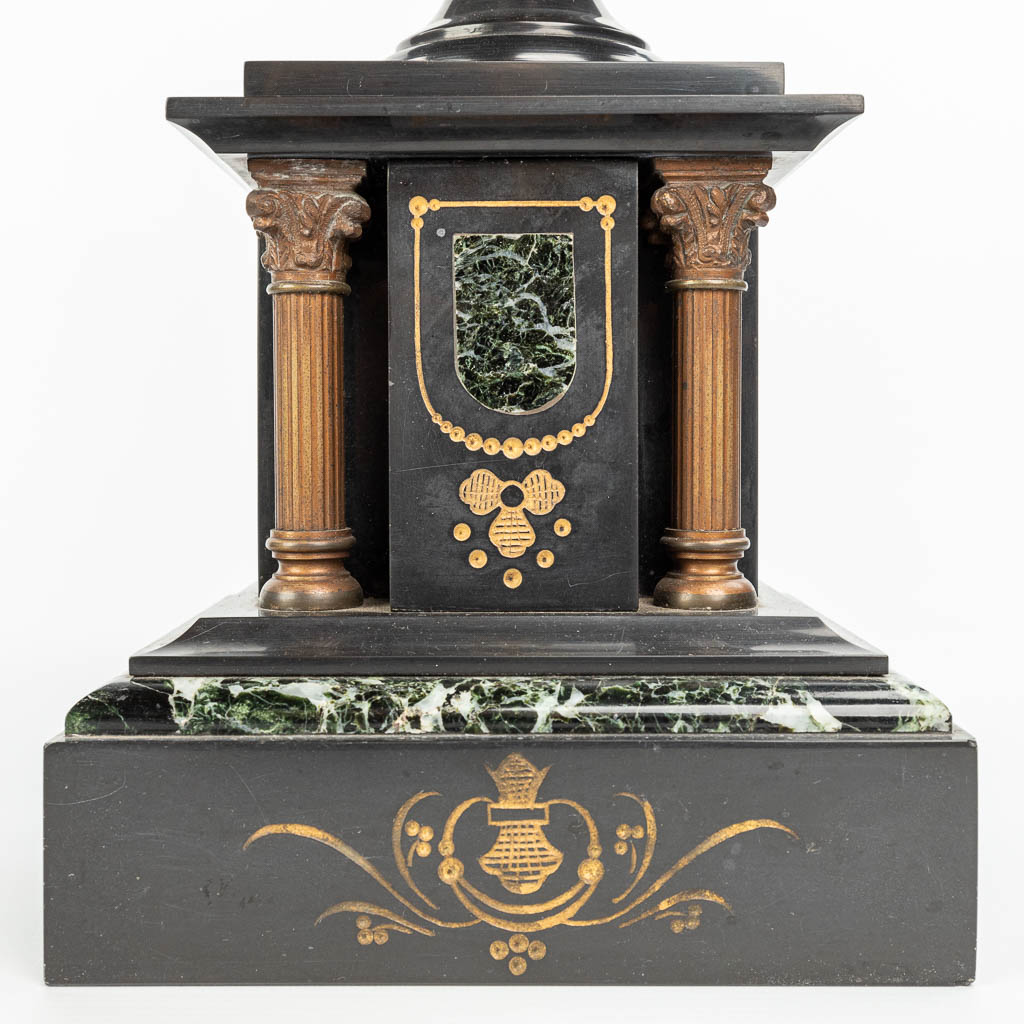 A three-piece garniture clock made of marble mounted with gilt bronze. (H:49cm)