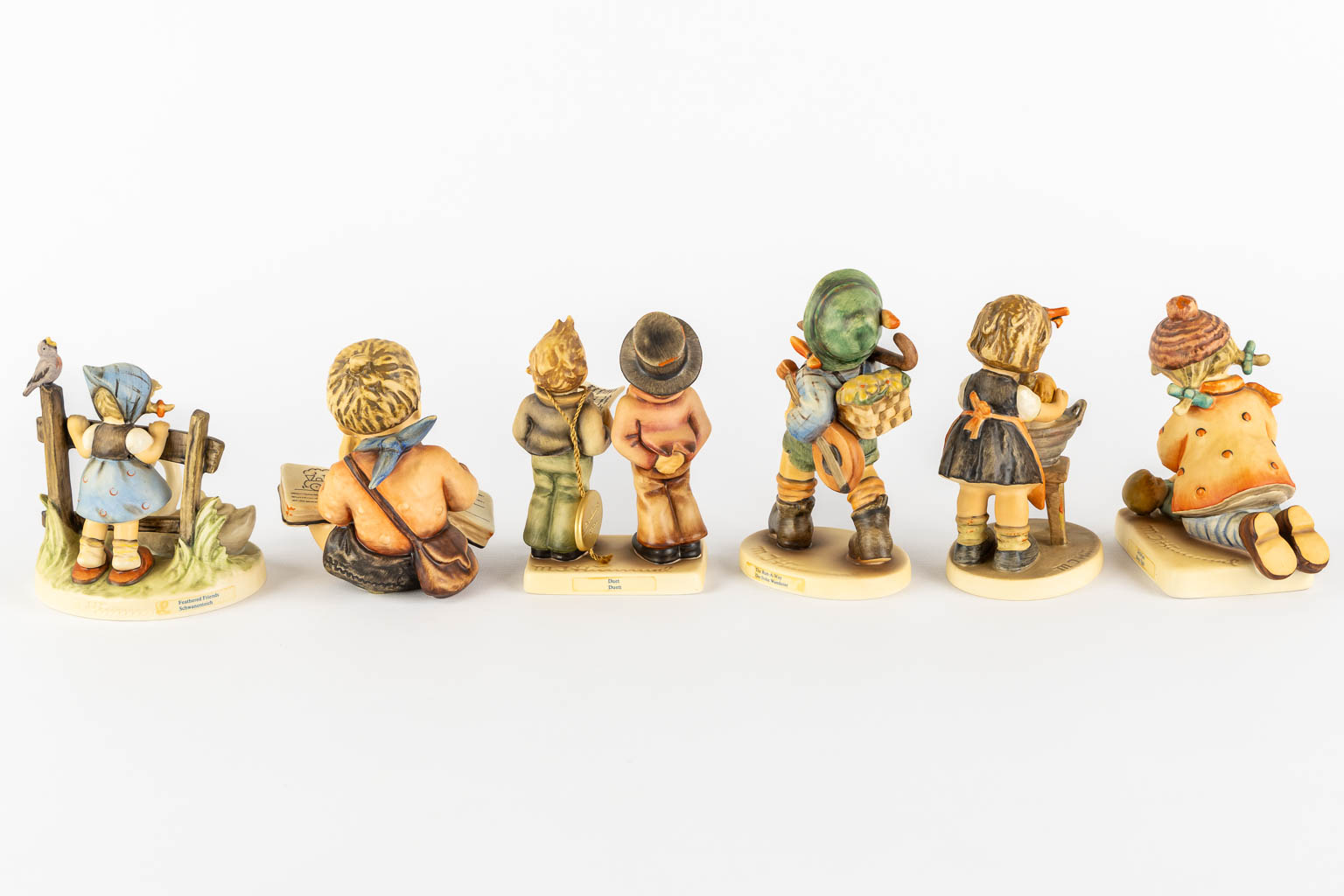 Hummel, 12 figurines, polychrome porcelain. (H:18,5 cm)