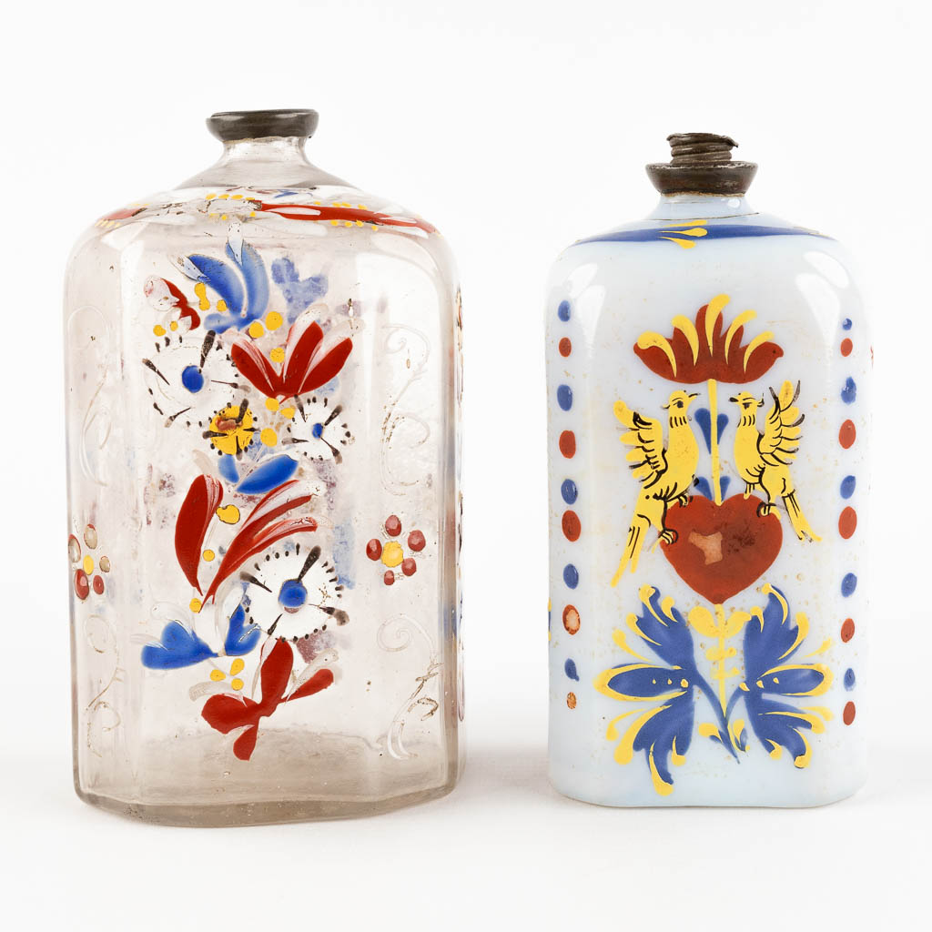 Two antique enamel hand-painted glass bottles, 17th/18th C. (H:13 cm)