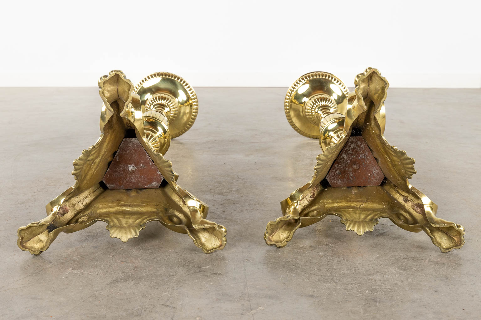 A pair of church candlesticks or candle holders polished bronze. 19th C. (D:24 x W:27 x H:88 cm)